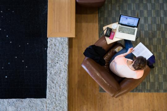 Student studying on their laptop in the Clausen Center